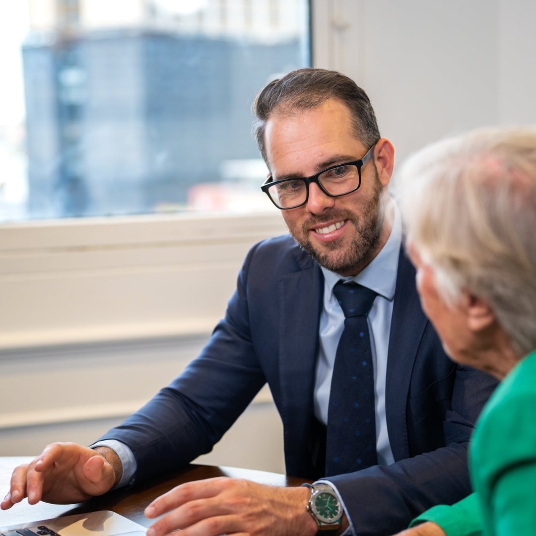 Attain Wealth Advisory adviser with a client