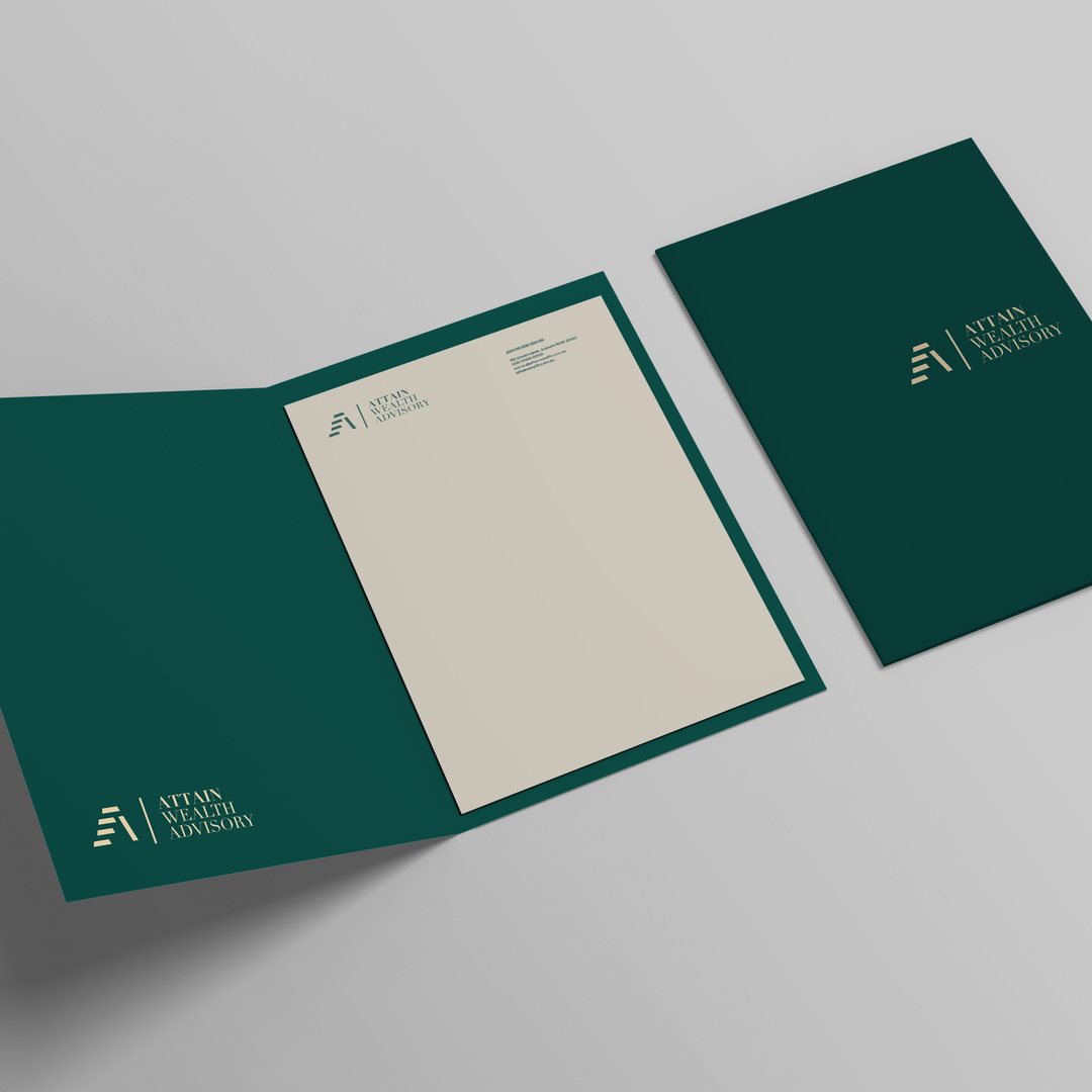 Green folder and letterhead printed with the Attain Wealth Advisory logo