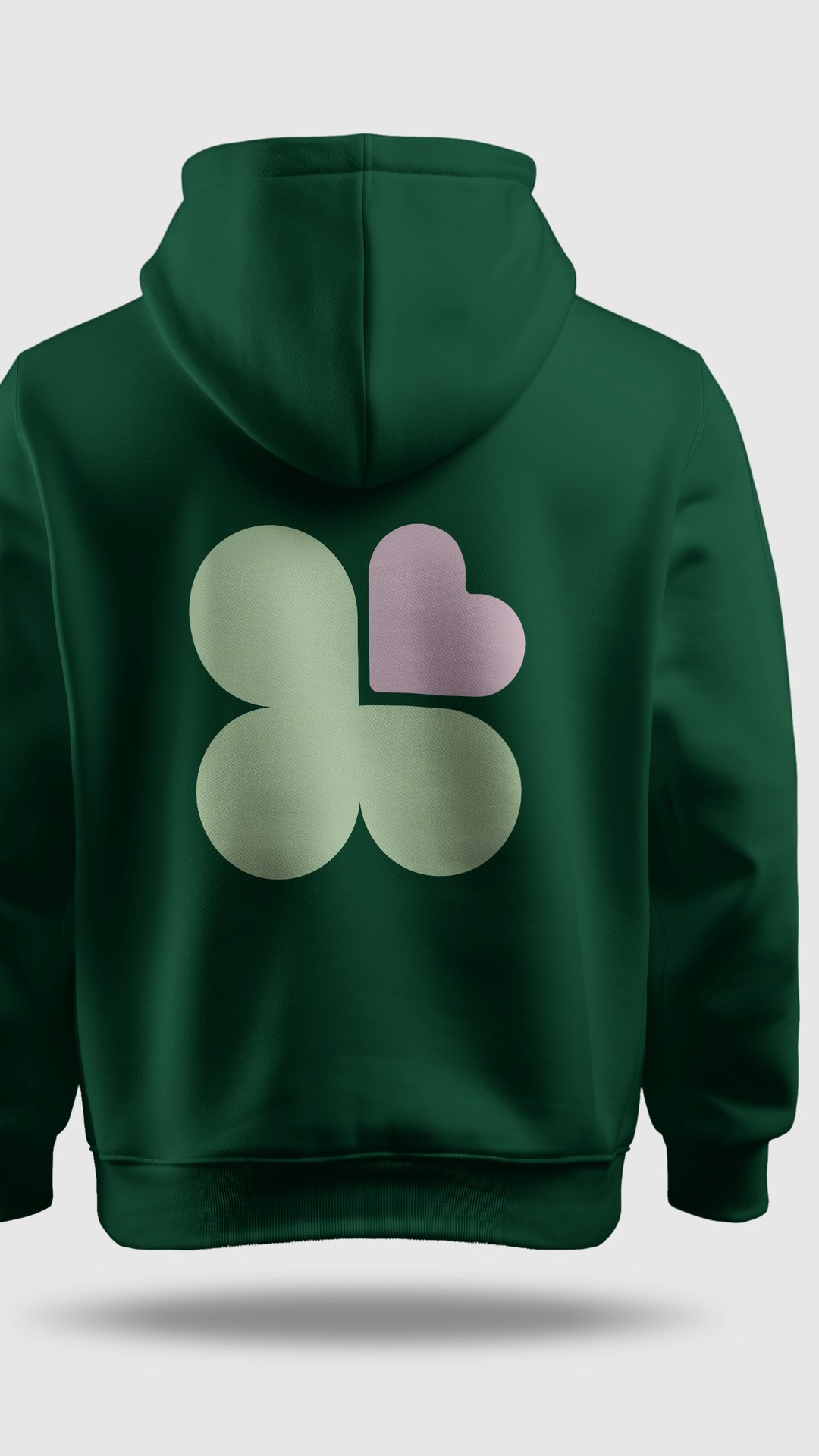 Caring Supports For You dark green hoodie with a large clover mark on the back