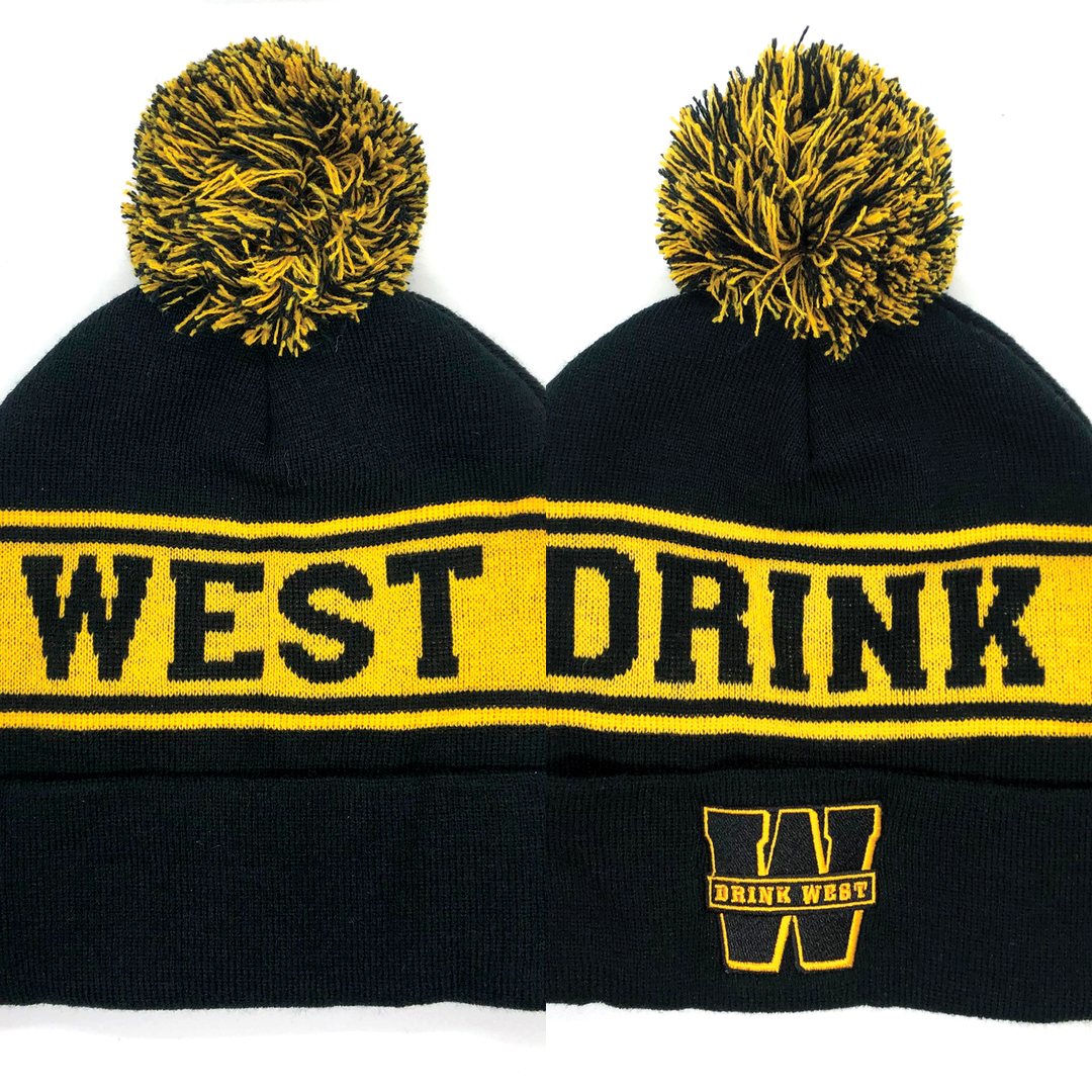 Black and yellow Drink West beanies with a pom-pom and the W logo