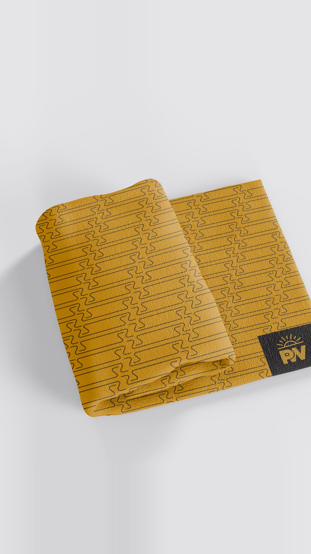 Folded yellow tea towel with a line pattern and a PW label